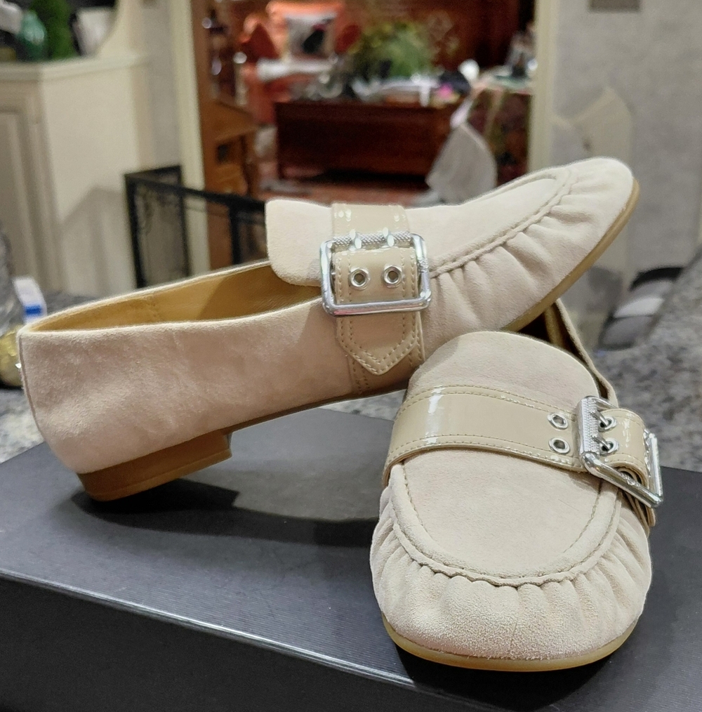 "UGG" Brand New, Sz.7.5 Cream "Charlotte" Loafers with Silver Buckle. Never Worn